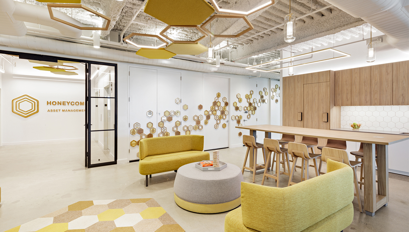Open-plan Honeycomb Asset Management workspace lit by suspended Duo fixtures