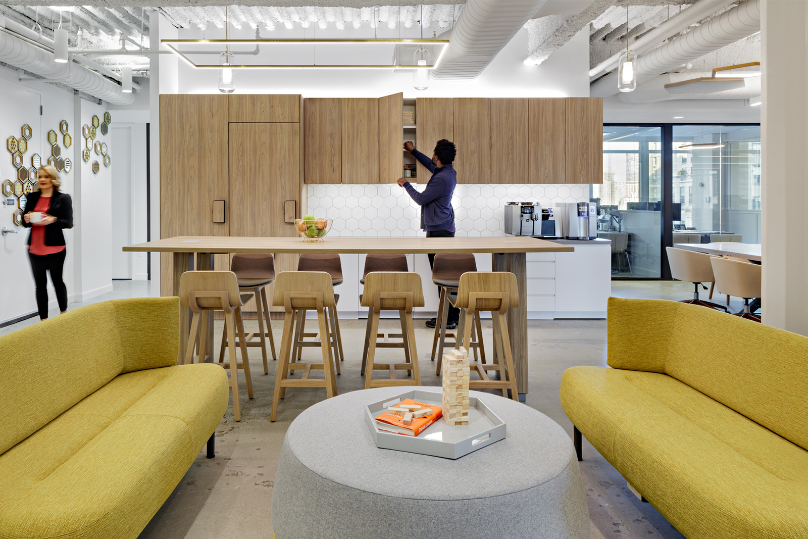 Honeycomb Asset Management office showing floating Duo luminaires over collaborative workspace