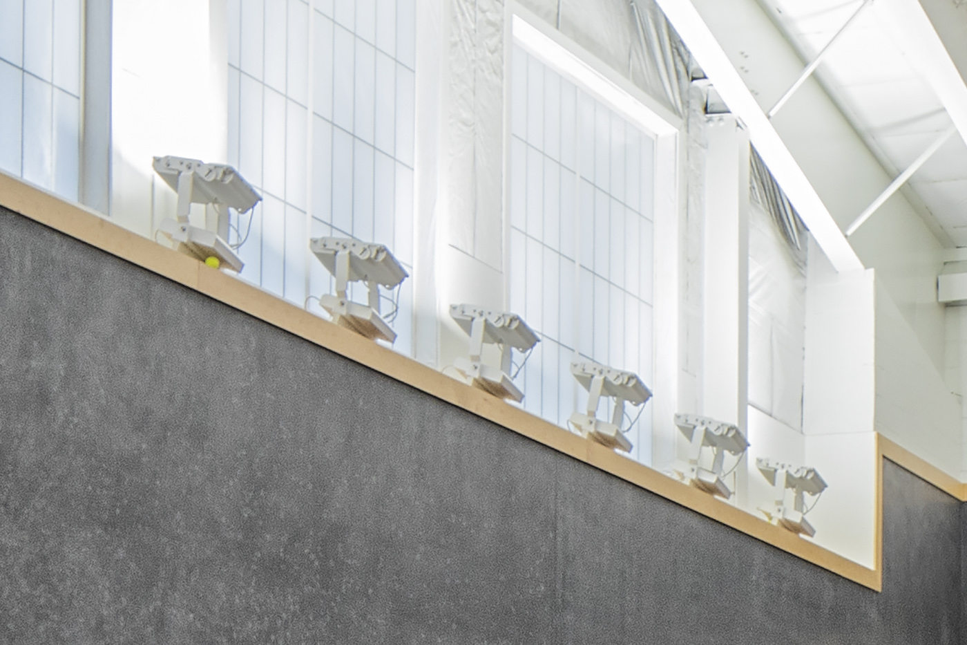 Bolt fixtures mounted on wall perimeter at Westwood Country Club