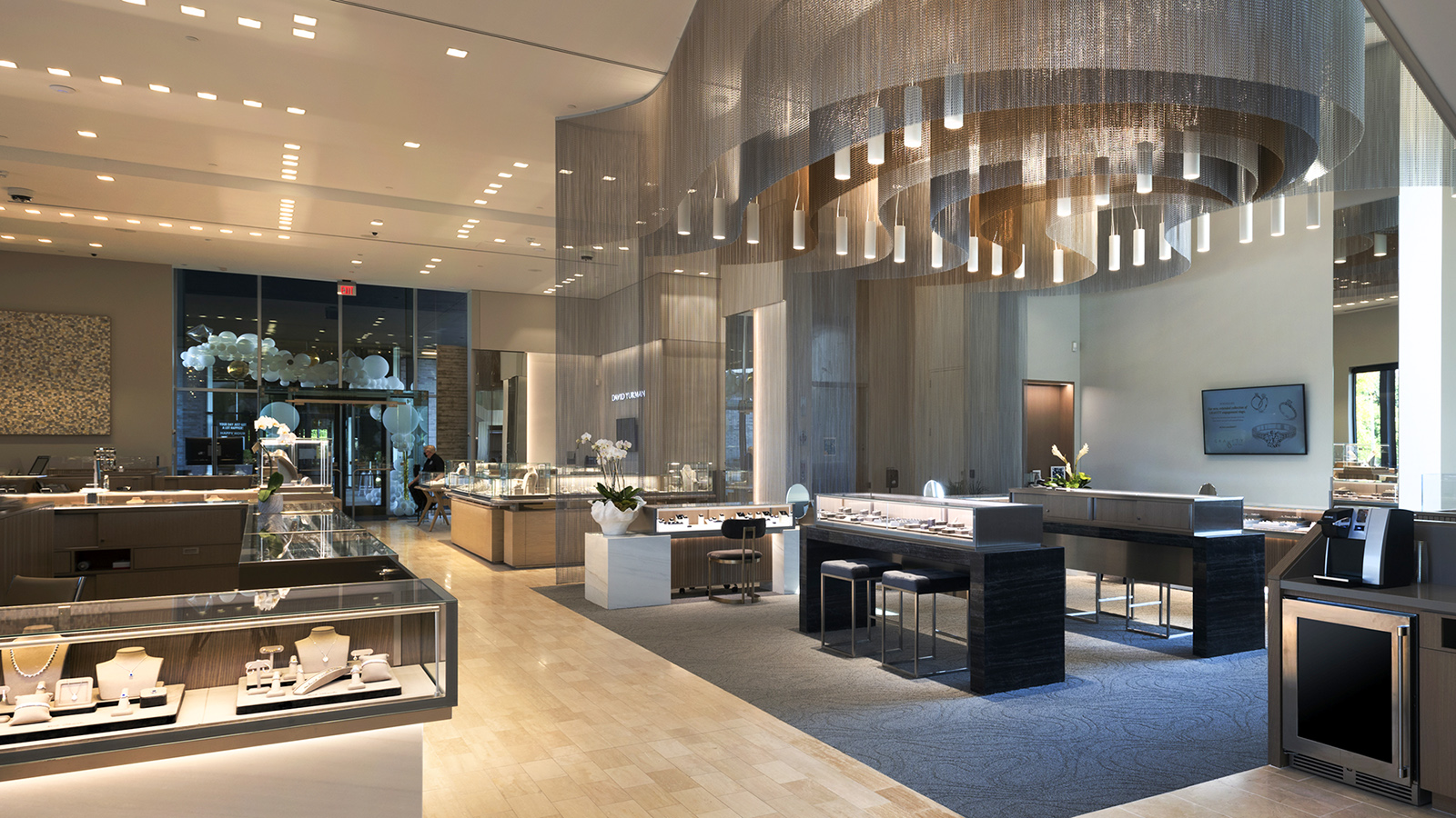 Close-up of the woven metal mesh ceiling installation at BC Clark Jewelers