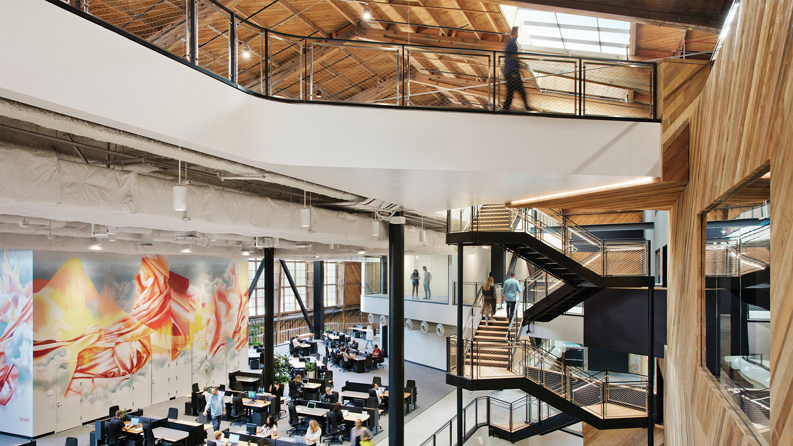 Wide view of the Google Spruce Goose hangar with illuminated work areas