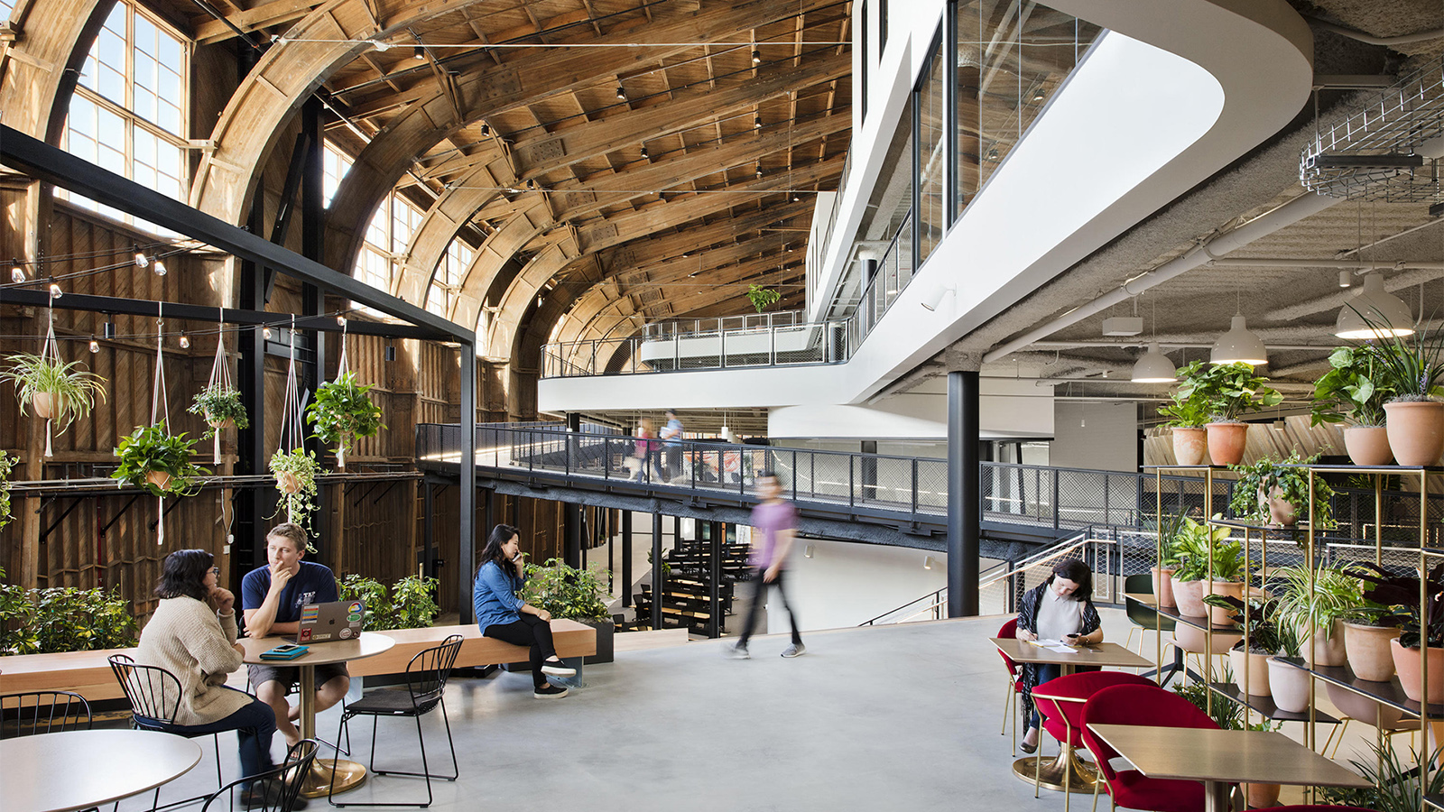 Panoramic interior of the Google Spruce Goose hangar with high-ceiling illumination