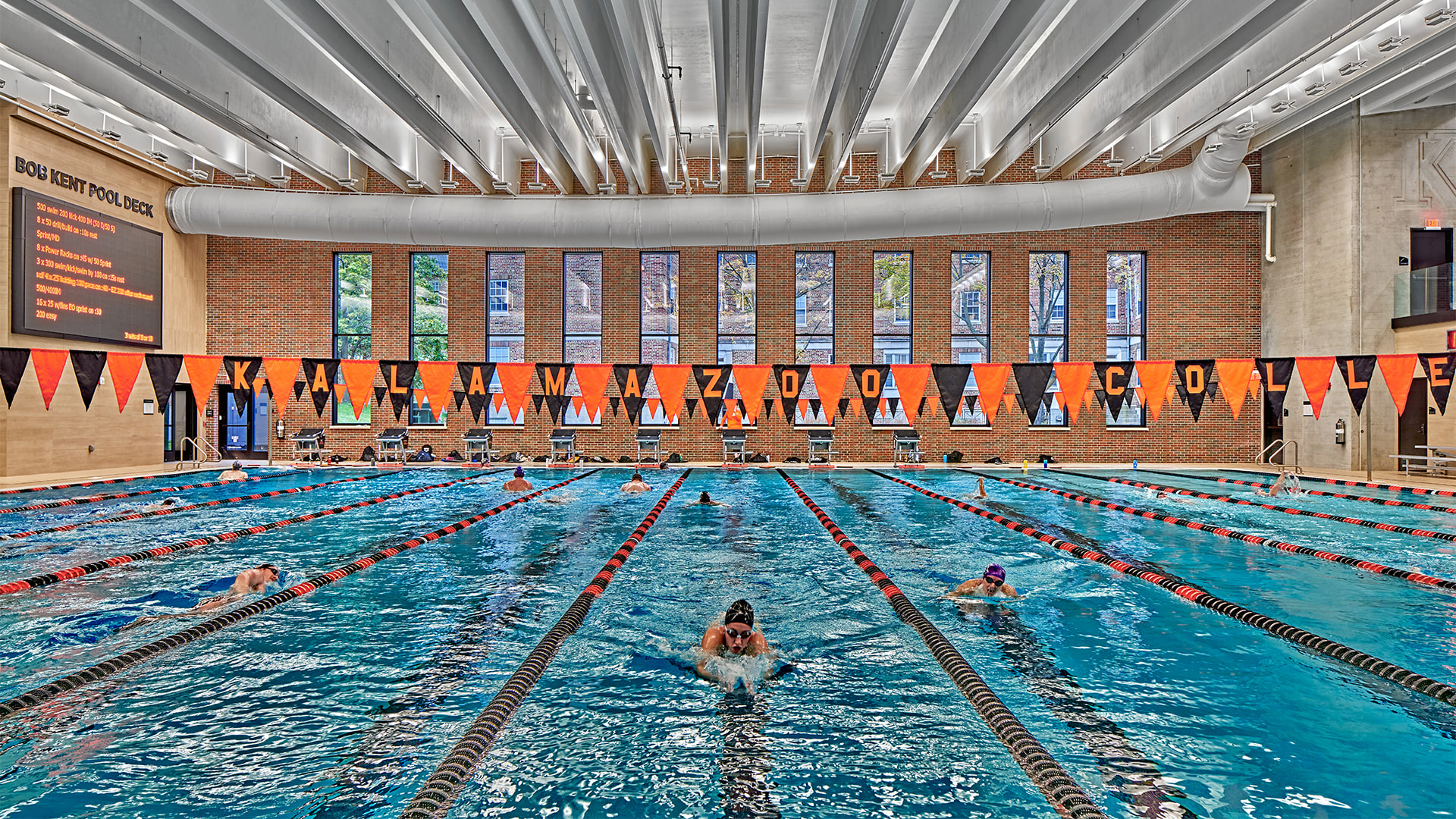 Kalamazoo College natatorium pool deck illuminated by indirect Bolt floodlights